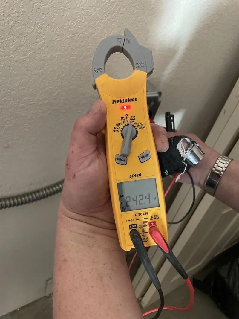 Voltage testing with clamp meter during Ceiling Fan Installation in Pembroke
